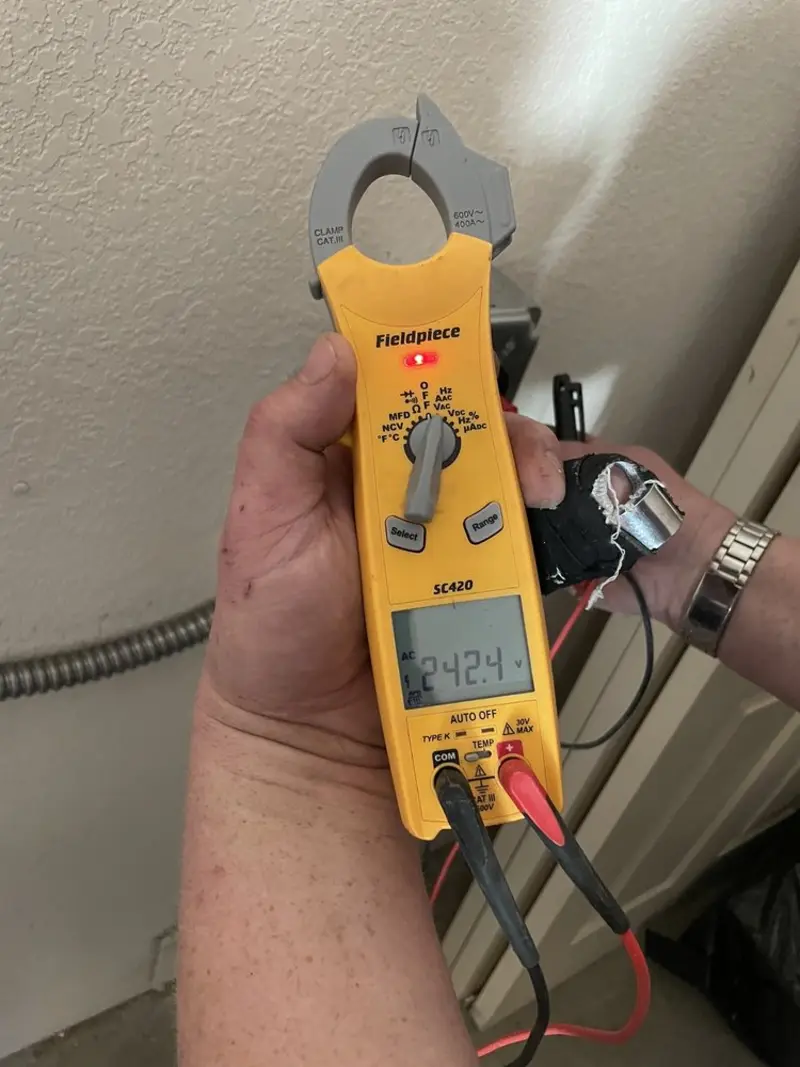 Voltage testing with clamp meter during Generator Installation in Albany